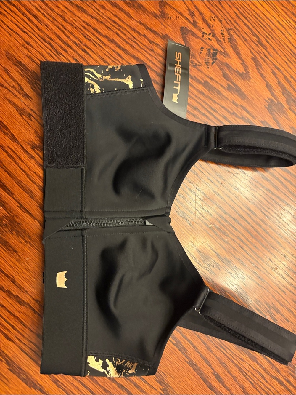 SHEFIT Black Sports Bra with Gold Accent